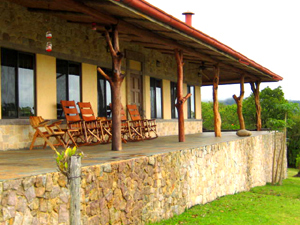 The covered veranda is on 3 sides of the home.