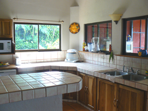 The kitchen is between the living room and deck, and has nice lake views.