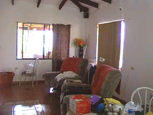 The large living room has a cathedral ceiling.