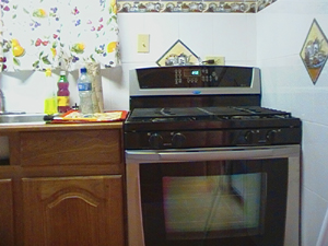 The kitchen has fine modern appliances.