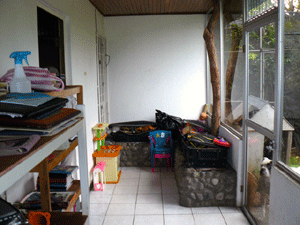 The garage wraps around to form this back patio.