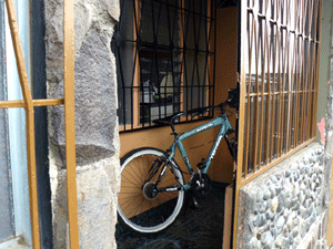 The exterior iron gate leads to small porch with the front door within, giving extra security.