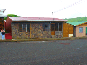 The stone-fronted house has a lockable garagewhich includes lot of extra space at the far end.