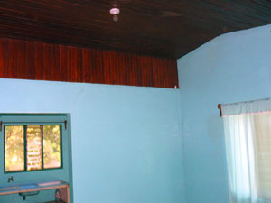 The central area has a high wood ceiling.