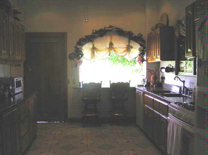 The large kitchen plenty of room and custom cabinetry.