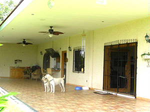 The 5-year-old home has a huge covered porch and wrought-iron security bars on the doors and windows.