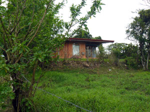 The westward side of the house has a covered porch from which to enjoy the sunset view. 