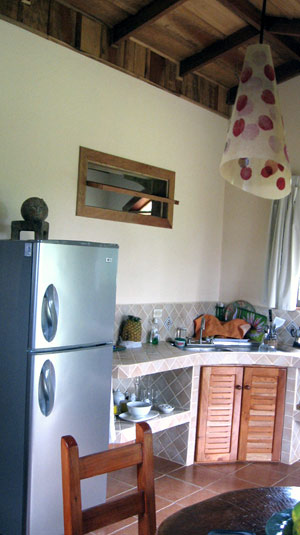 The kitchen is part of the high-ceilinged open plan.