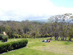 Children play on a broad lawn in one of the property's many sectioned areas. 