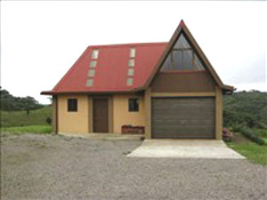 The two-story cottage with garage.