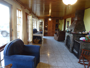 The well-furnished sala spans the front of the house.