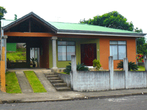 The attractive home has a convenient carport, a very attractive entry, and and nice landscaping.