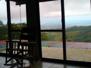 Sliding doors open to a small deck on the veranda roof for fresh-air sunset views.