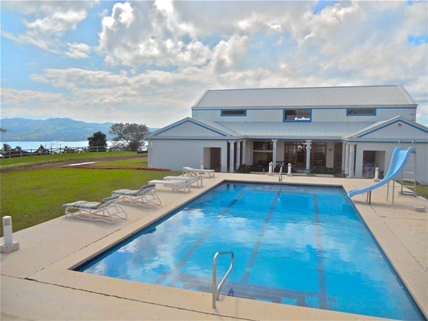 The 18 by 36 pool offers swimming and soaking with an imposing lake and mountain view.