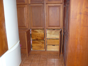 The kitchen has an extraordinary amount of beautiful and clever cabinet storage.