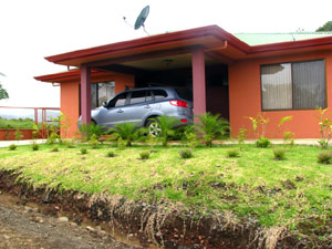 A handy circular driveway brings the driver to the front door under a sheltering porch.