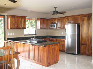 The kitchen is a well designed roomy space with fine appliances and woodwork.