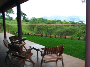 On the lake side of the house is a broad, roofed patio.