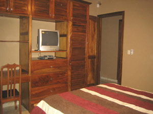 The second bedroom has a bathroom and built-in closet with desk of fine Guanacaste hardwood.