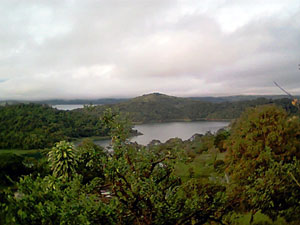 The close below the house is a cove and a forested island before the wide lake.