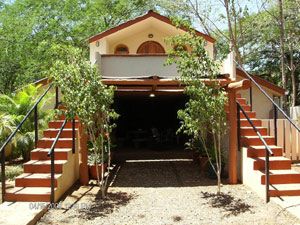 The south side has two stiarways to the second level rooms flanking the main living area on the first floor. 