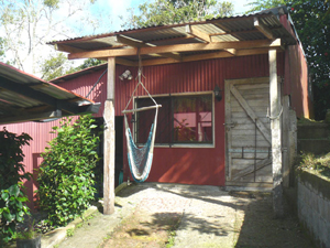 An apartment behind the house can be rented or used for caretaker.