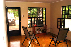 The living room of the current house was sparsely furnished until recently.