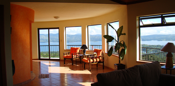 The roomy, many-windowed 3-story home has superb lake, volcano and territorial vistas from all rooms.