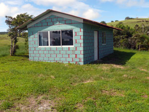 A rental cabin and open campling area sit above the house. 