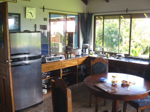 The kitchen is part of the living room, dining room open area with lake and territorial views. 