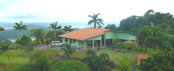 From the horse exercise ring, this is a view of the house and lake.