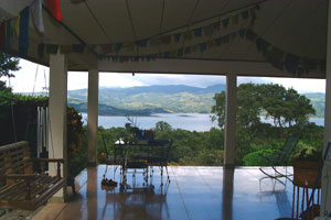 The wide house-wrapping patio is a great place to relax and enjoy the lake and 3-volcano vista.