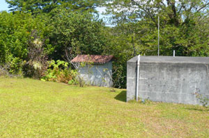 Above the compound sits a huge concrete water reservoir and a pump house to supply a constant forceful supply  of water from the owner's own well. 