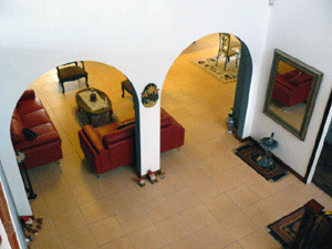 From the family room balcony, here is a view of the center hallway and the arches leading to the living room.