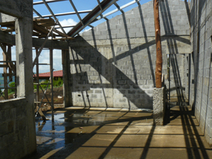 The roof soars over the open kitchen, dining and living room areas.