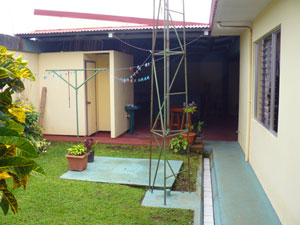 The back garden leads to the barbecue and recreation area in the huge garage.