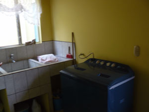 There is a separate laundry room off the kitchen and back garden. 