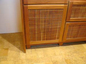 The travertine floor in the kitchen and living room has been expertly fitted from random sizes of the stone tile.