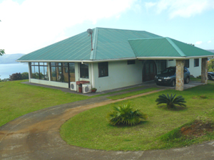  home has a large porte cochere and a circular driveway.