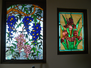 Light from the sun room beautifies the stained glass windows in the library.