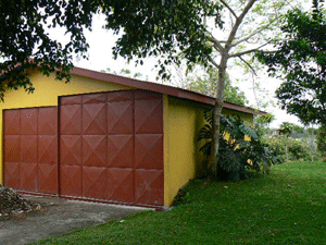 The oversize garage with space for motor home has secure metal doors.