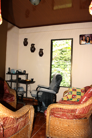 The living room is spacious with a tall ceiling.