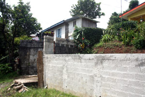 The house sits high above the short street.