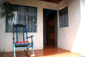 A small covered porch leads to the front door.