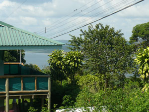 Lake Arenal can be seen past the neighbor's house. 