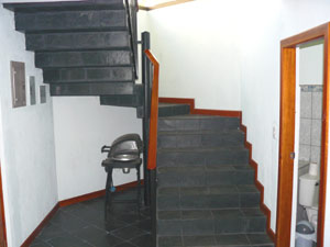 A well-designed stairway with landing leads to the second floor.