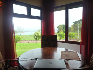 The dining area looks over the nearby cove and the lake beyond.