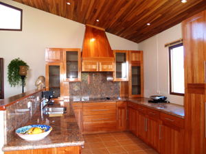 The fine kitchen, part of the open plan, has fine appliances and a lake view. 