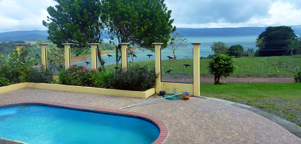 The view of pool and lake from the bedroom building.