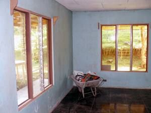 Remodeling underway in the southwest corner of the house, consisting of two sleeping rooms, the larger also a living room, a modernized bathroom, and a kitchenette. 